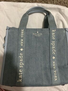 kate spade light blue denim-look tote with cream interior